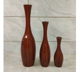 3 sizes of vases next to the living room