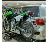 Motocross strap behind the car