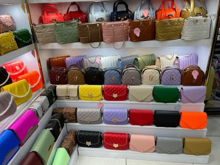 A leather bag made of artificial leather with a wreath design