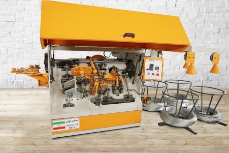 Machine for producing linear barbed wire in two strands