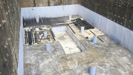 Foundation moisture isolation with PVC geomembrane