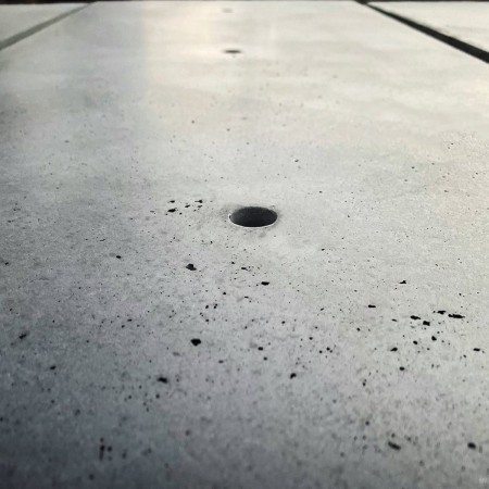 Exposed concrete floor and wall panel