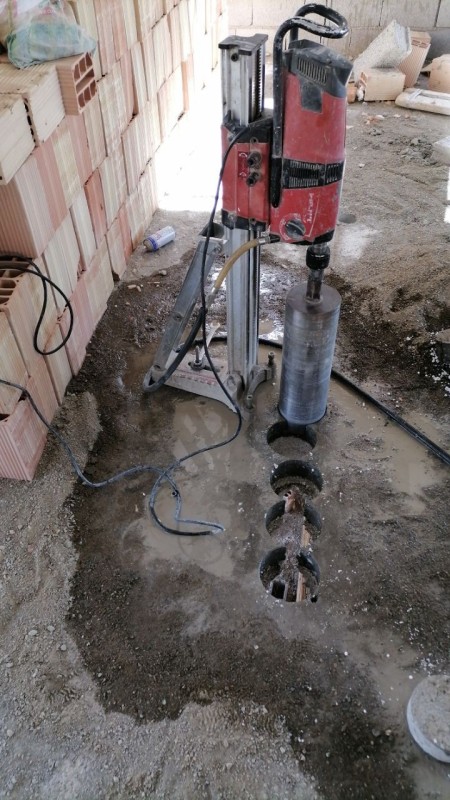 Drilling of all types of reinforced and unreinforced concrete, with a drilling machine