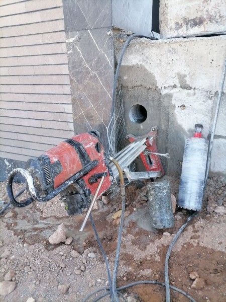 Drilling of all types of reinforced and unreinforced concrete, with a drilling machine