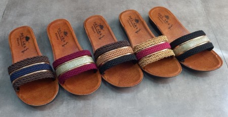Production and distribution of slippers, shoes and sandals for men, women and children