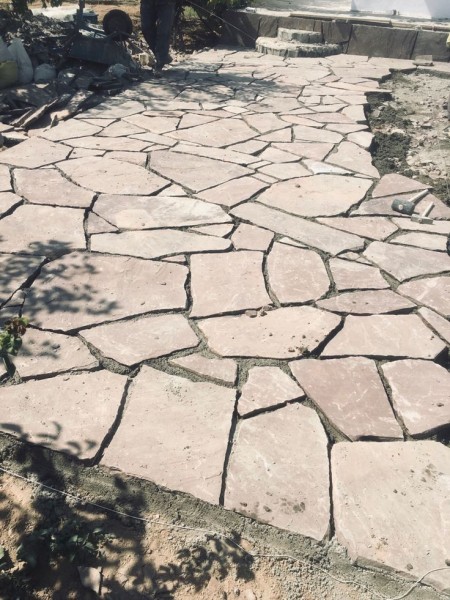 Implementation of stone slab design from stone slab with a frieze face
