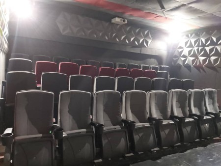 Cinema chair with popcorn handle