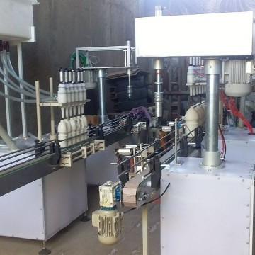 دستگاه پرکن مایعات رقیق با دربند اتومات