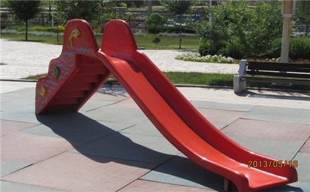 Golden fiberglass park slides