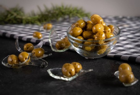 Broken olives in peace olive oil